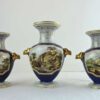 Davenport porcelain garniture of 3 vases - with camel head decoration