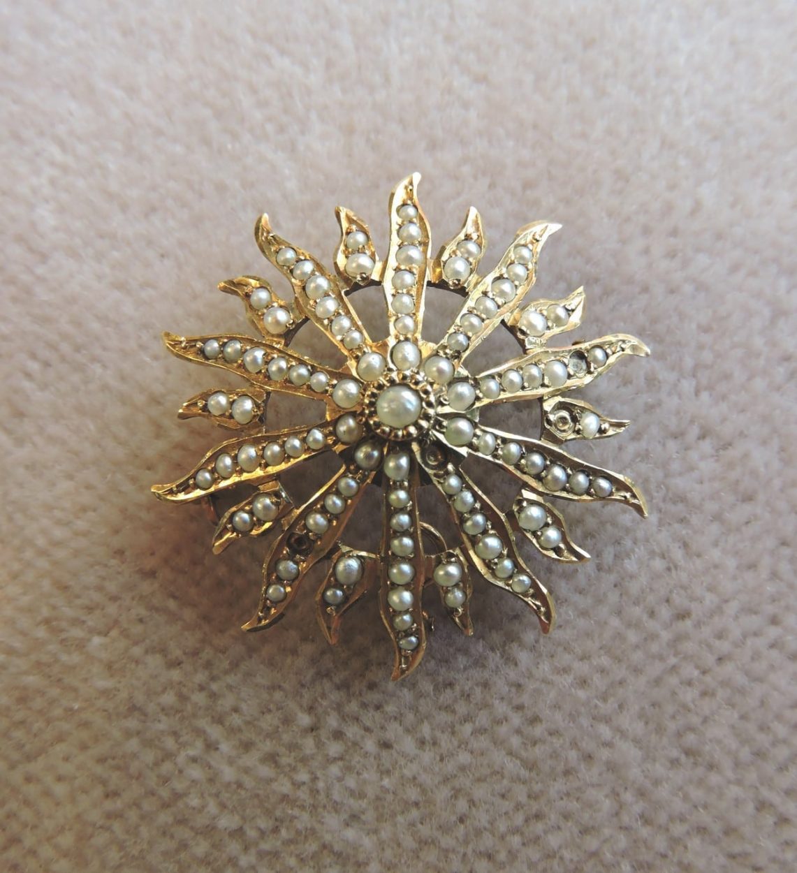 14 karat gold and seed pearl Starburst Brooch - circa 1900.