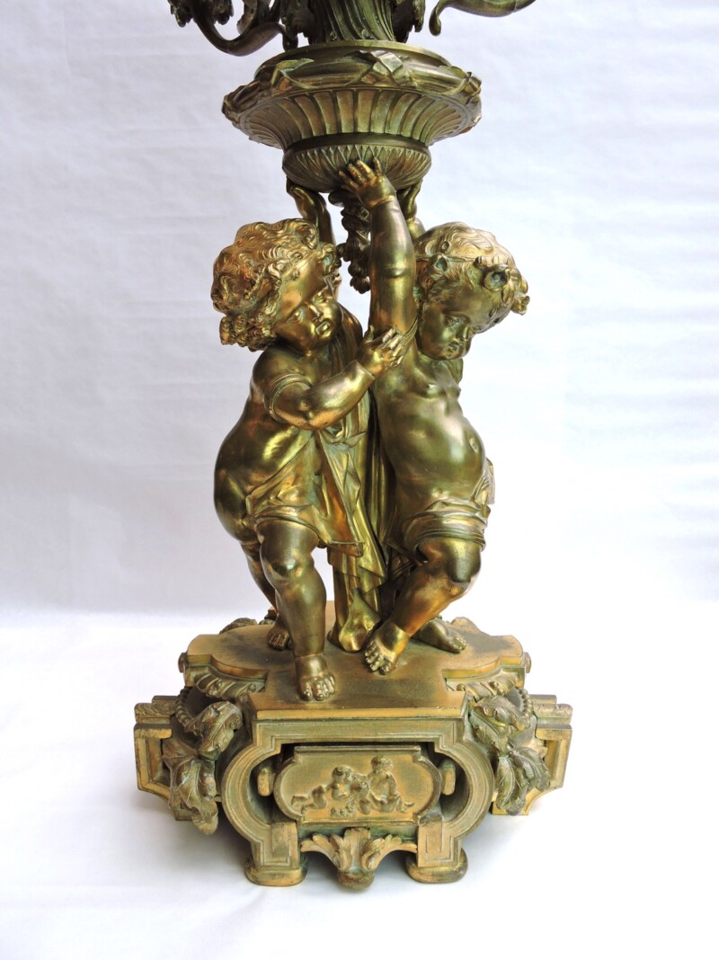 putti figures in gilt bronze