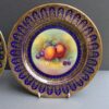 close up paragon fruit plates signed J Martin