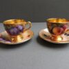 pair of fruit scene hand painted cups and saucers by Richard Budd Royal Worcester