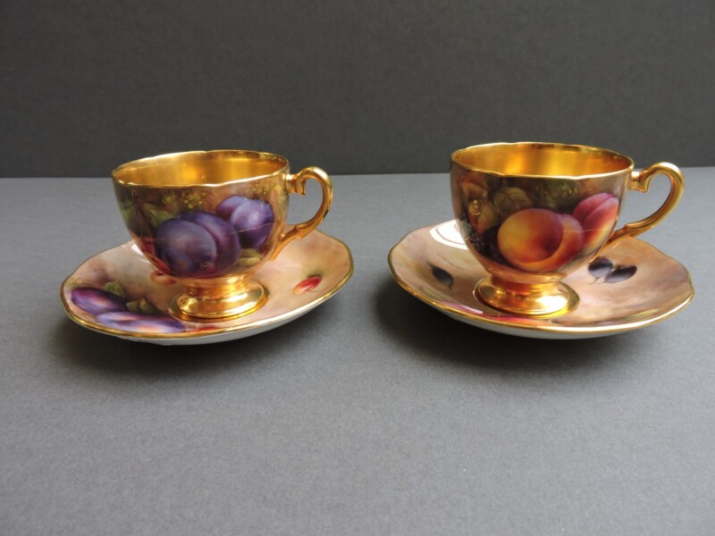 pair of fruit scene hand painted cups and saucers by Richard Budd Royal Worcester