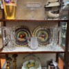 various porcelains and crystal antiques in cabinet