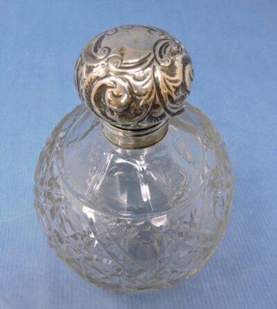 Victorian Age cut glass double ended deals scent bottle. Silver ends.